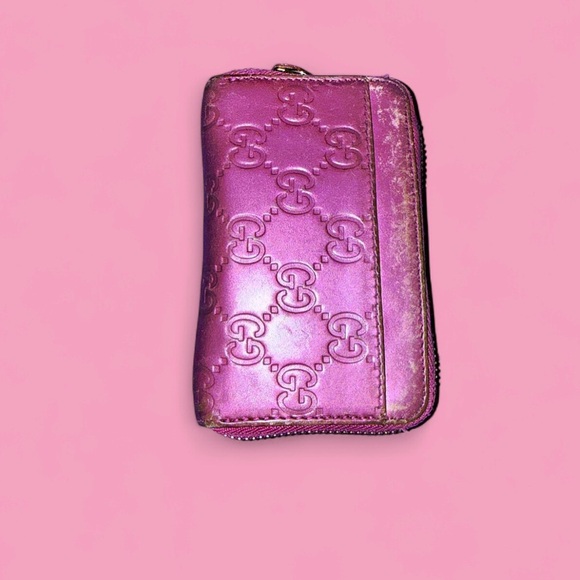 Authentic Gucci Guccissima heart charm zip-around wallet in pink leather